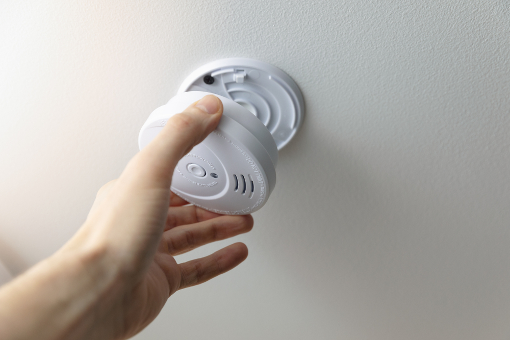 Image of someone fitting a smoke alarm