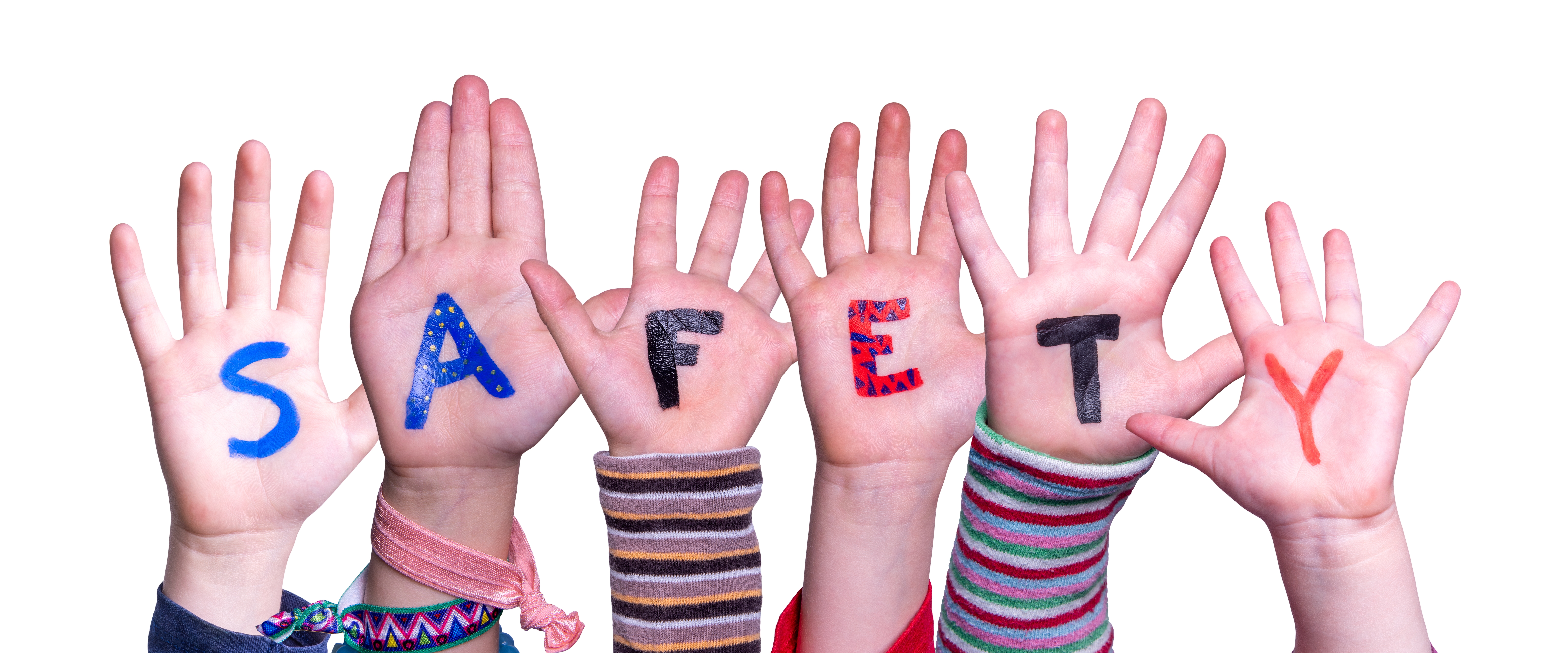 Children's hands held up spelling out Safety