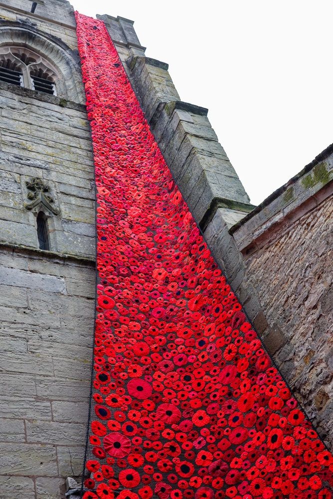 Poppy tribute on the side of a church