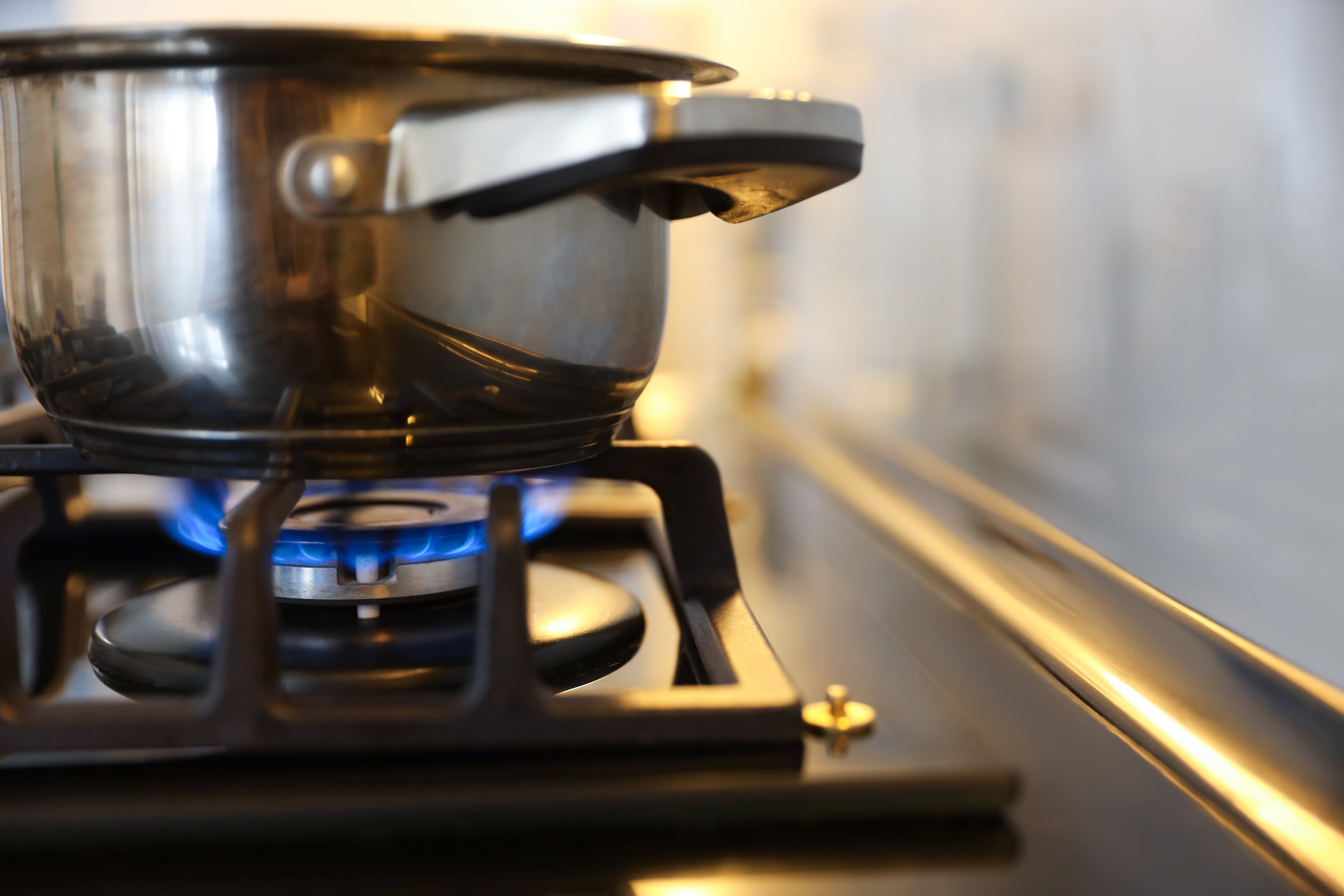 A image of a pot on a gas cooker hob