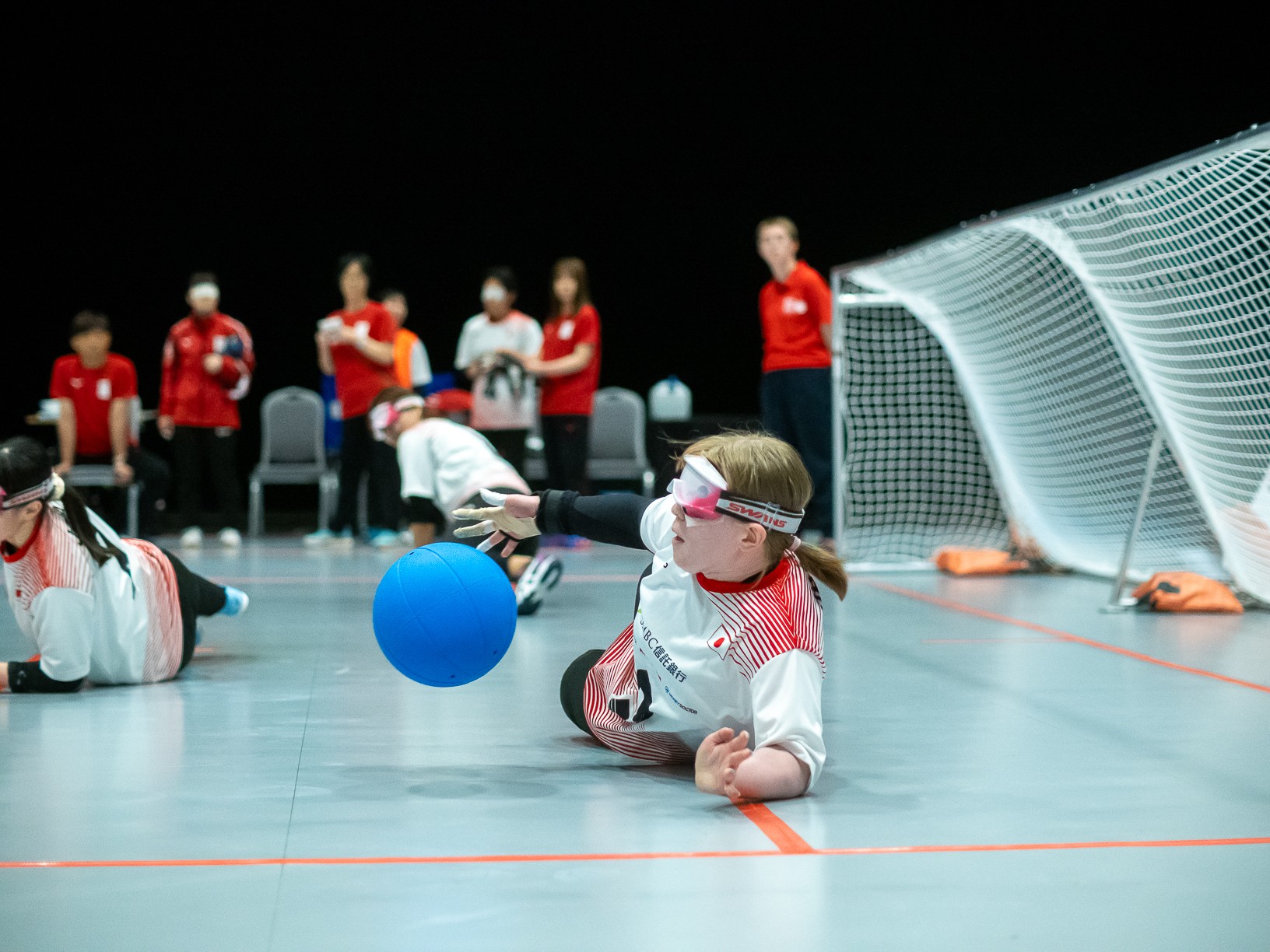 Female competitor playing a goalball game at the IBSA World Games 2023.
Image credit: British Blind Sport